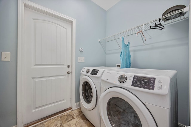 laundry room featuring laundry area and washer and clothes dryer