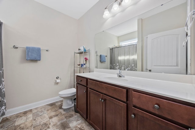 full bath with a shower with curtain, vanity, toilet, and baseboards