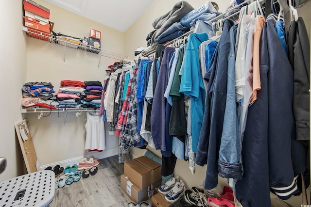 spacious closet with wood finished floors