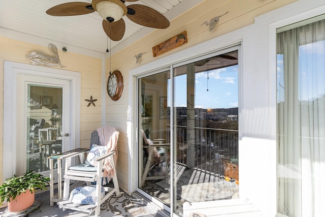 sunroom featuring ceiling fan