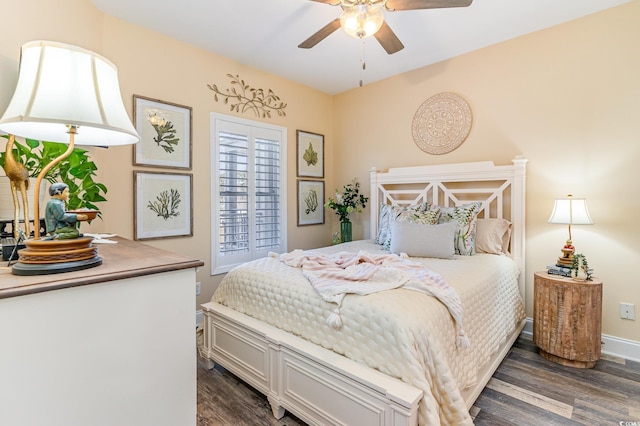 bedroom featuring dark wood-style floors, ceiling fan, and baseboards