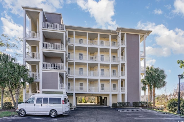 view of property featuring uncovered parking