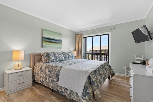 207 3rd Ave N Unit 348, North Myrtle Beach, SC 29582 - bedroom featuring access to outside, crown molding, light wood finished floors, and baseboards