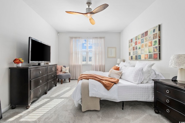 bedroom with light carpet and ceiling fan