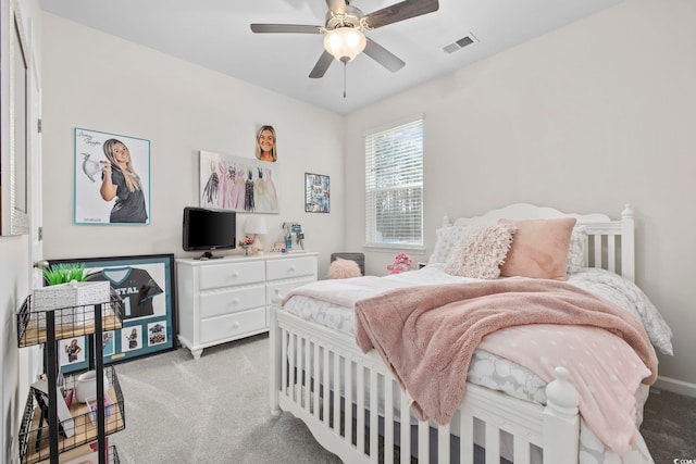 bedroom with ceiling fan, carpet floors, and visible vents