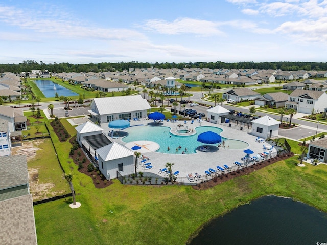 bird's eye view featuring a water view and a residential view