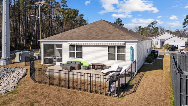 back of property with a patio, fence, an outdoor living space, a yard, and roof with shingles