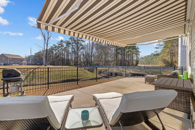 view of patio with fence and area for grilling