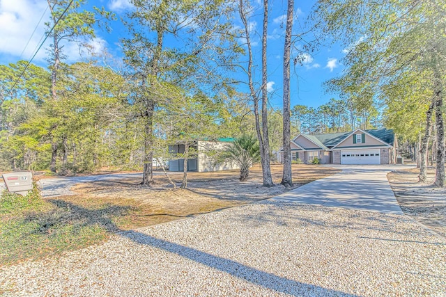 view of front of home featuring a garage and concrete driveway