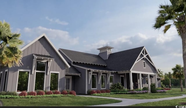 exterior space featuring a front lawn and board and batten siding