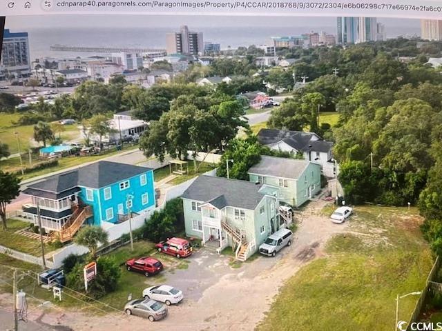 drone / aerial view featuring a city view