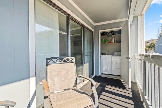 balcony featuring independent washer and dryer and a sunroom