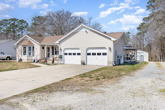 single story home featuring driveway and an attached garage