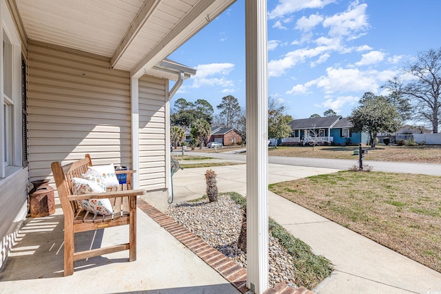 view of patio featuring a porch