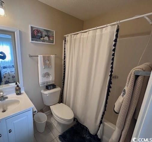 bathroom with toilet, vanity, shower / bath combination with curtain, and tile patterned flooring