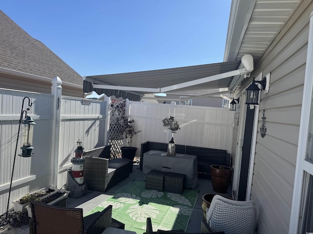 view of patio / terrace with an outdoor hangout area and fence