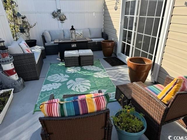 view of patio / terrace featuring fence and an outdoor hangout area