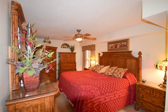 bedroom featuring a textured ceiling and carpet flooring