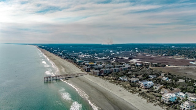 bird's eye view with a water view and a beach view