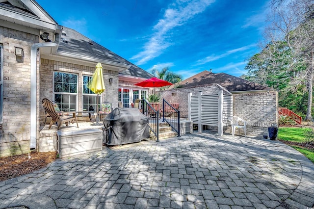 view of patio featuring a deck and area for grilling