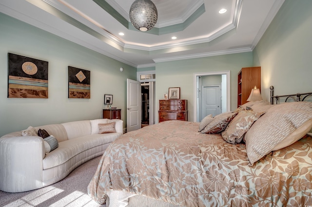 carpeted bedroom featuring ornamental molding, a raised ceiling, and recessed lighting