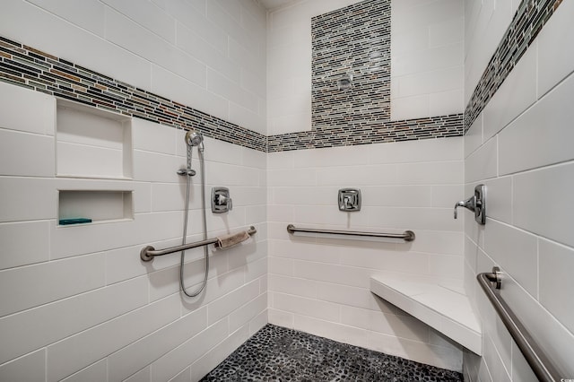 bathroom featuring tiled shower