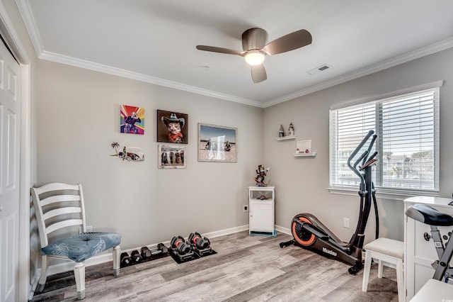 exercise area featuring visible vents, ornamental molding, ceiling fan, wood finished floors, and baseboards