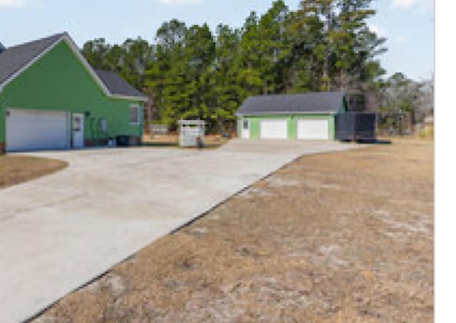 view of side of property with driveway