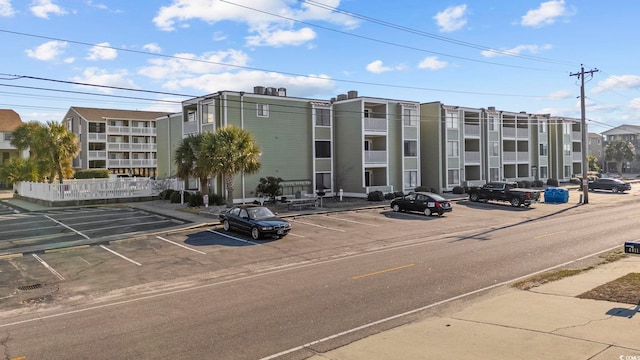 view of property featuring uncovered parking