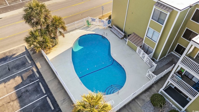 pool featuring a patio area and fence