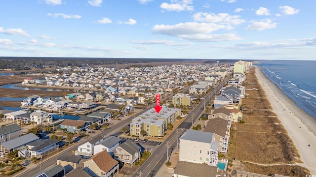 bird's eye view with a water view, a residential view, and a view of the beach