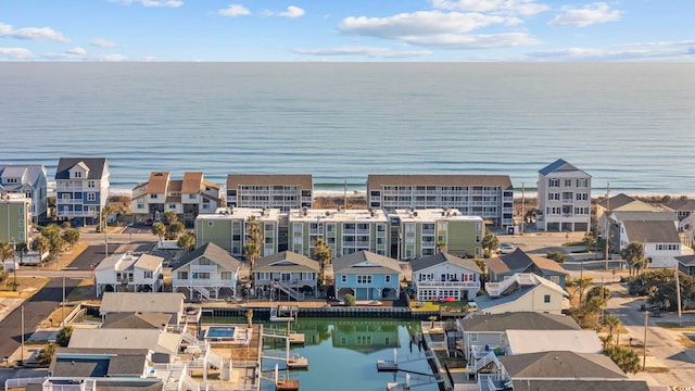 birds eye view of property with a residential view and a water view