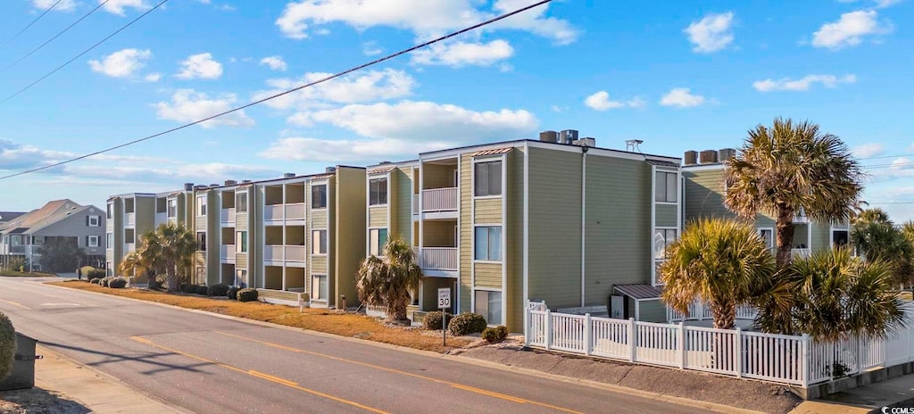 4801 N Ocean Blvd Unit 3E, North Myrtle Beach, SC 29582 - view of property featuring fence and a residential view