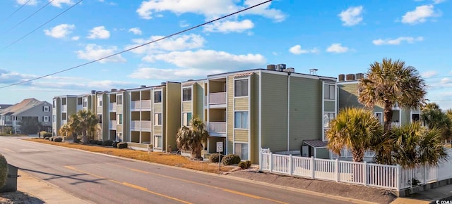 4801 N Ocean Blvd Unit 3E, North Myrtle Beach, SC 29582 - view of property featuring fence and a residential view