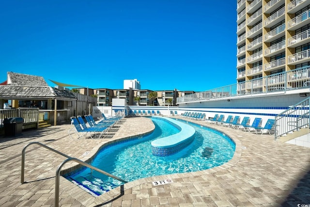 community pool with a patio