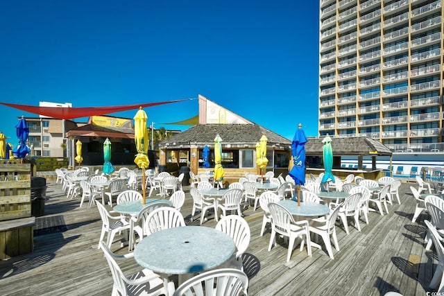 deck with outdoor dining space