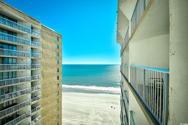 property view of water featuring a beach view