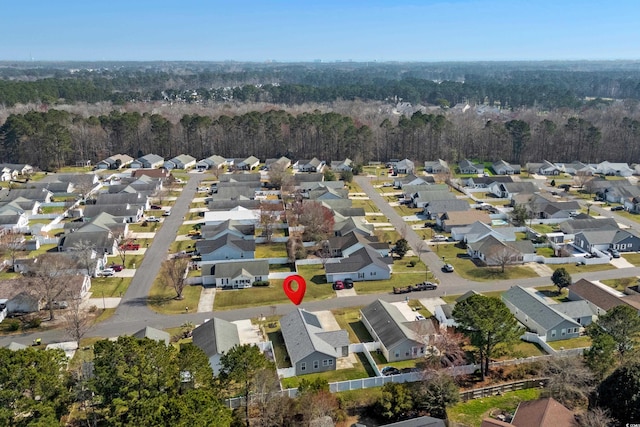 birds eye view of property with a residential view