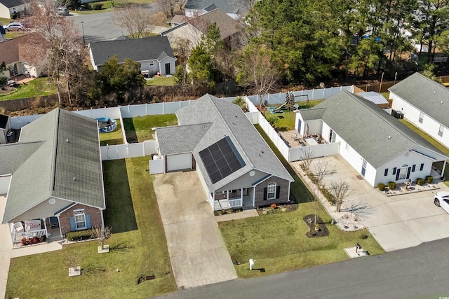 birds eye view of property with a residential view