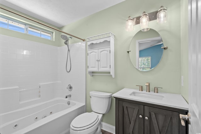 full bathroom featuring toilet, vanity, and a combined bath / shower with jetted tub