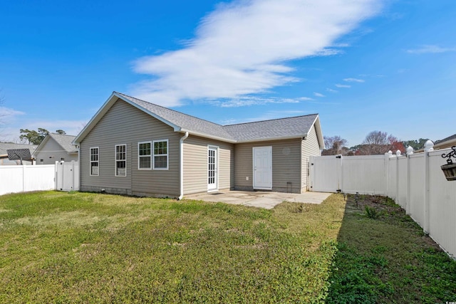 rear view of property with a patio, a fenced backyard, and a lawn