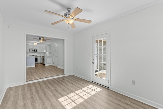 unfurnished room featuring baseboards, light wood-type flooring, and ornamental molding