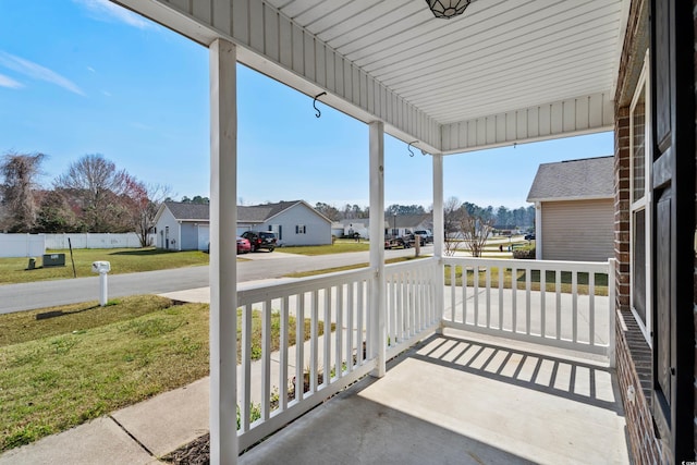 view of patio featuring a porch and a residential view