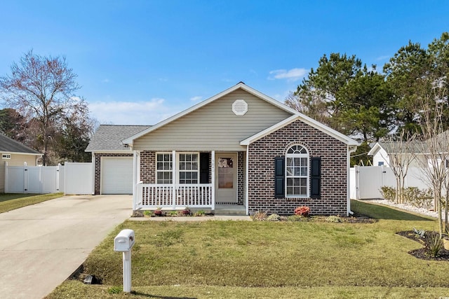 ranch-style house featuring a gate, brick siding, and driveway