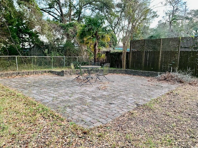 exterior space featuring outdoor dining space and a fenced backyard