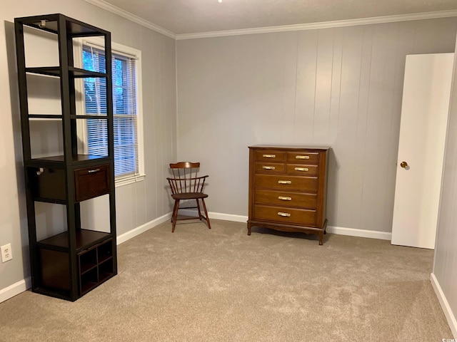 living area featuring baseboards, carpet floors, and crown molding