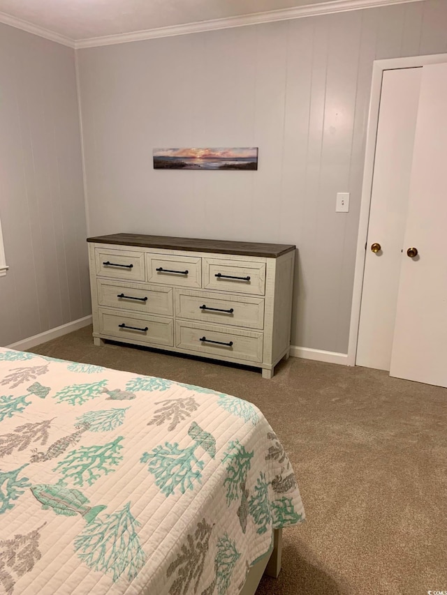 bedroom featuring baseboards, ornamental molding, and dark carpet