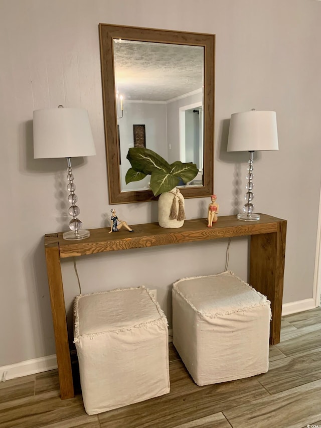 details featuring baseboards and wood finished floors