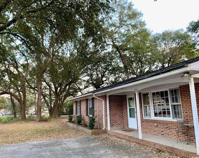 view of front of house featuring brick siding