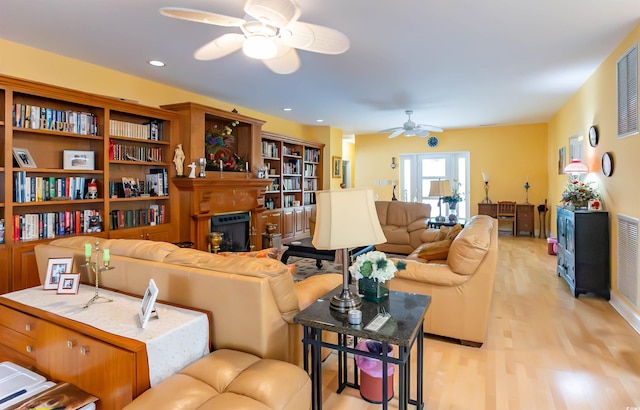 4244 Luck Ave, Little River, SC 29566 - living room featuring ceiling fan, light wood-style flooring, a fireplace, and recessed lighting